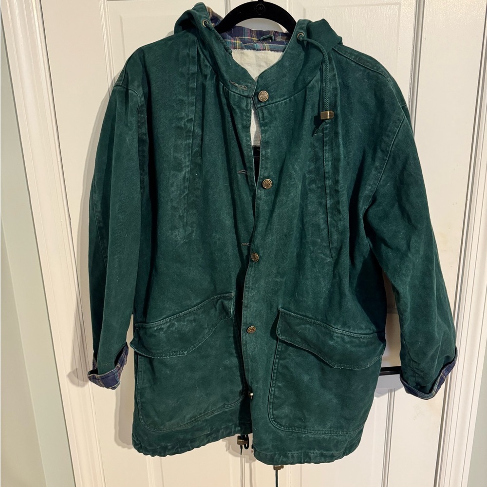 Vintage green denim barn jacket with flannel plaid lining and hood.